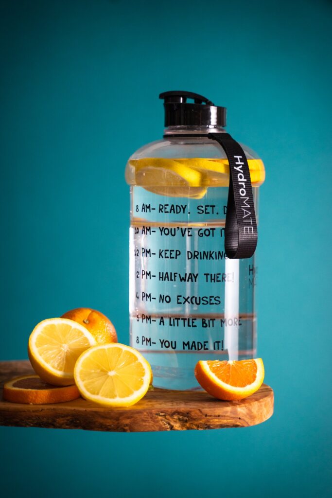 refresh with better design - a motivational bottle or water and fresh lemons
